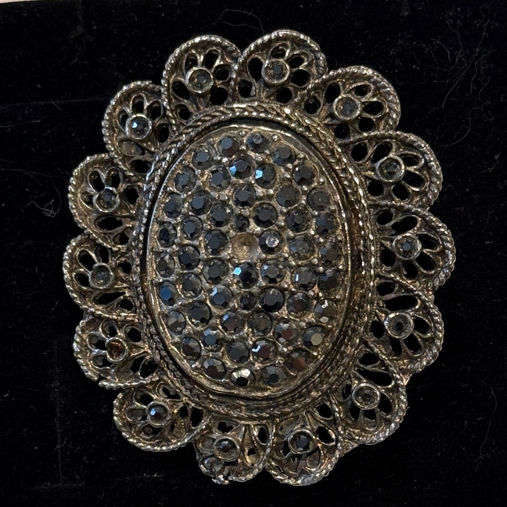 Elegant Silver Brooch with Black Accents